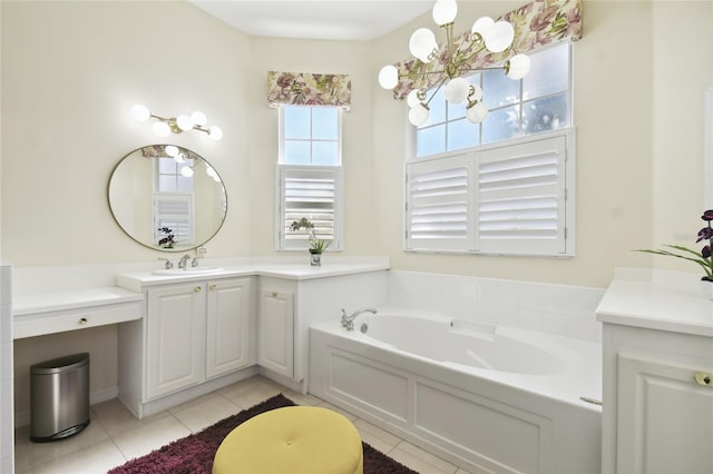 bathroom featuring tile patterned flooring, a washtub, and vanity