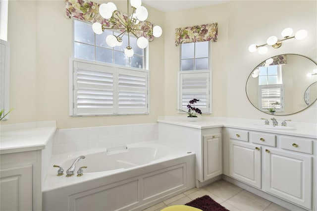 bathroom featuring tile patterned flooring, a washtub, and vanity