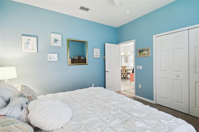 carpeted bedroom featuring a closet