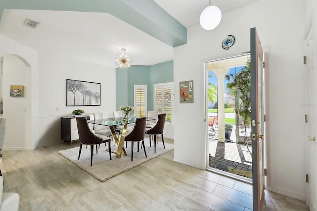 dining area featuring a notable chandelier