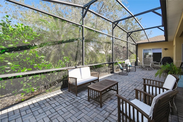 view of patio / terrace with outdoor lounge area and glass enclosure