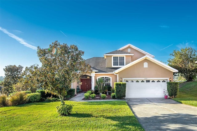 view of front facade featuring a front lawn and a garage