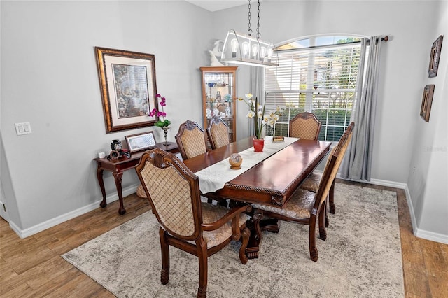12213 Still Meadow Dr, Clermont, FL 34711 - dining room with a chandelier and light wood finished floors