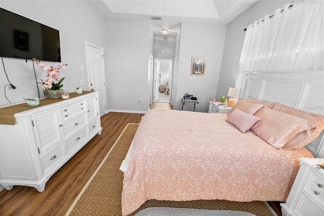 12213 Still Meadow Dr, Clermont, FL 34711 - bedroom with dark wood finished floors and baseboards
