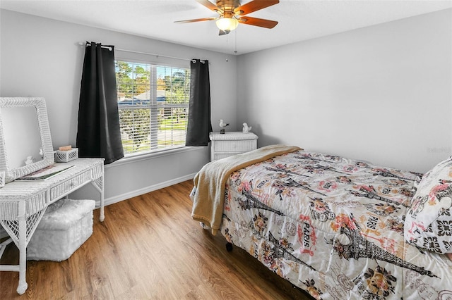 12213 Still Meadow Dr, Clermont, FL 34711 - bedroom with light wood-style flooring and ceiling fan