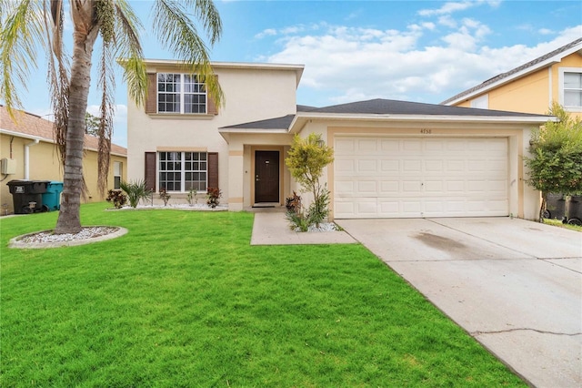 view of front of home featuring a front lawn and a garage