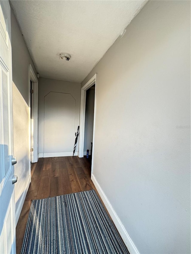 hall featuring dark hardwood / wood-style floors