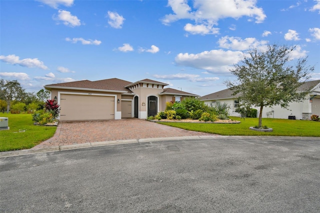 view of front of house with a front lawn and a garage