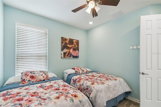 bedroom featuring hardwood / wood-style flooring and ceiling fan