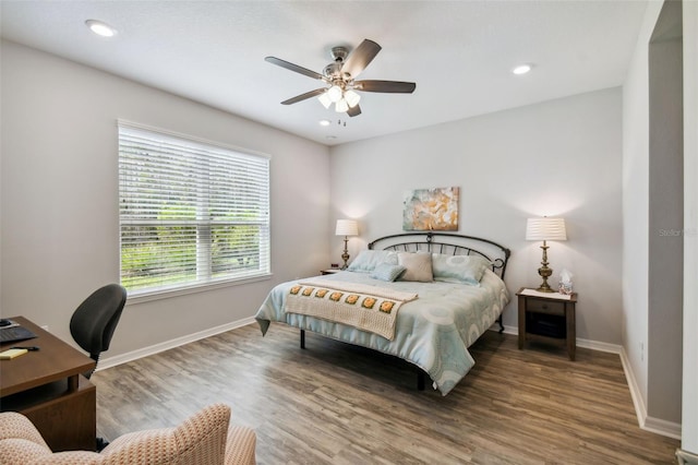 bedroom with wood-type flooring and ceiling fan