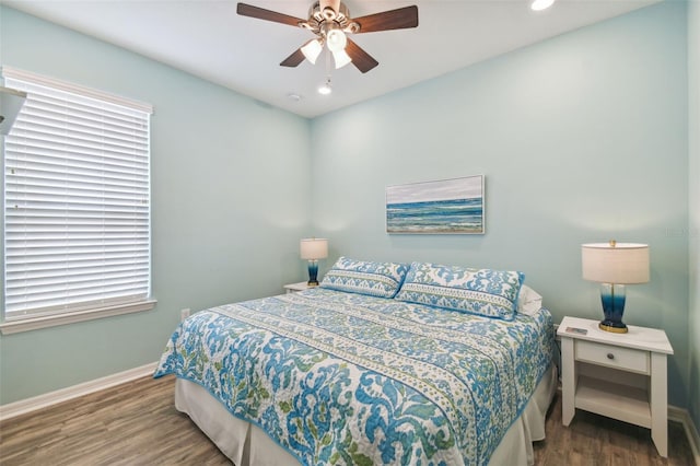 bedroom featuring hardwood / wood-style flooring and ceiling fan