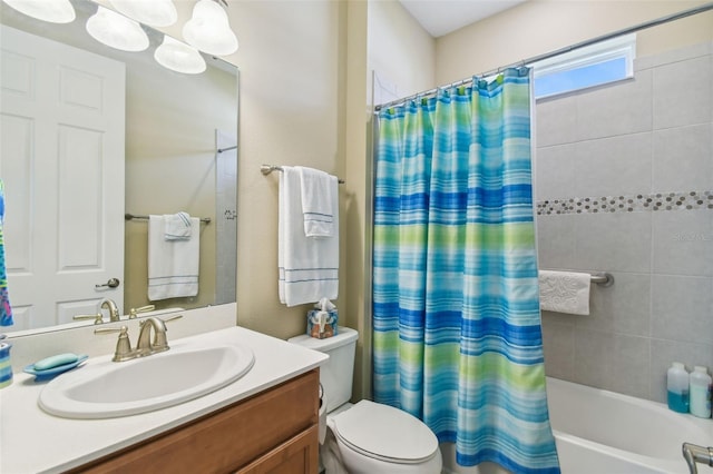 full bathroom featuring toilet, shower / bath combo, and vanity