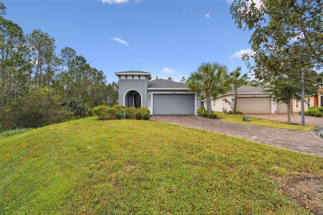 mediterranean / spanish-style house with a front lawn and a garage