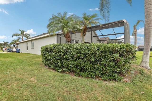 view of yard with a lanai