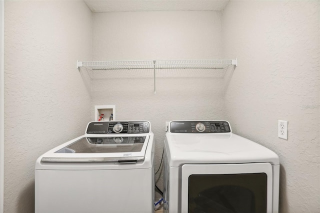 laundry room featuring washer and clothes dryer