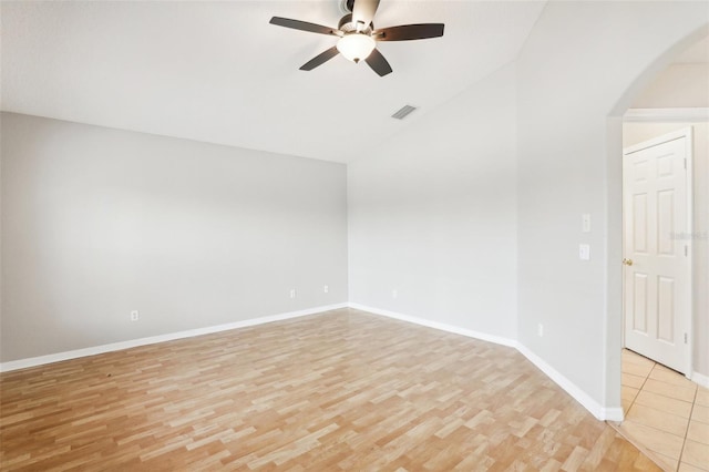 unfurnished room with light hardwood / wood-style floors, ceiling fan, and lofted ceiling