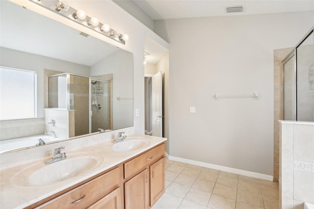 bathroom with vanity, shower with separate bathtub, vaulted ceiling, and tile patterned floors