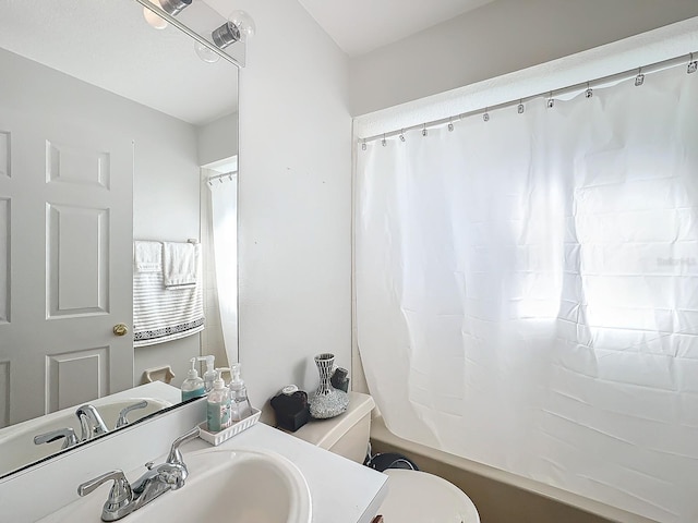 full bathroom featuring vanity, toilet, and shower / tub combo