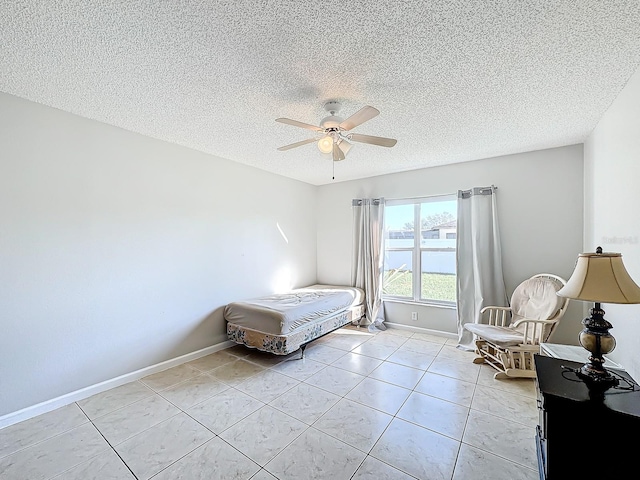 tiled bedroom featuring a water view, a textured ceiling, and ceiling fan