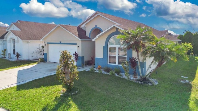 view of front of house with a front lawn and a garage