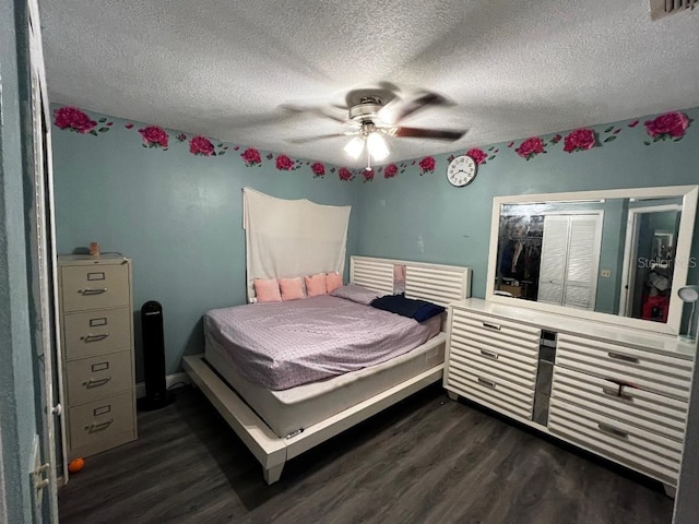 2440 Summerfield Way, Kissimmee, FL 34741 - bedroom with a closet, a textured ceiling, visible vents, dark wood-style flooring, and ceiling fan