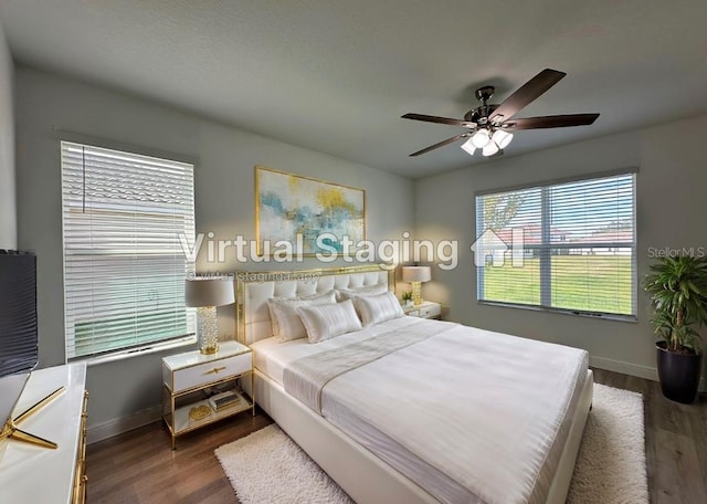 bedroom featuring dark wood-type flooring and ceiling fan