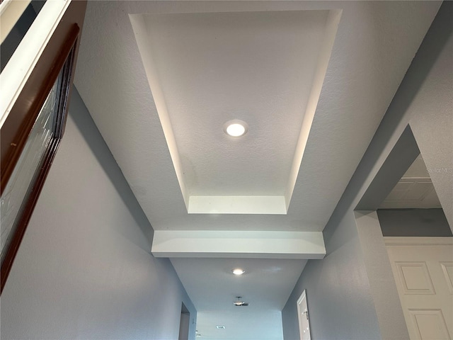 interior details with a tray ceiling