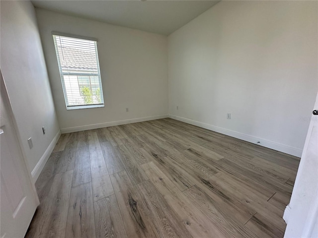 unfurnished room featuring light hardwood / wood-style floors