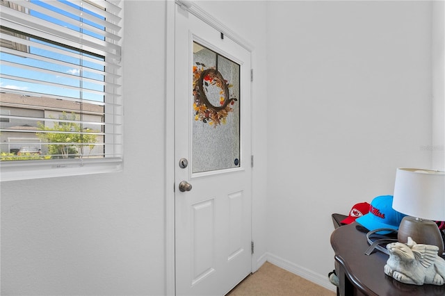 entryway featuring carpet flooring