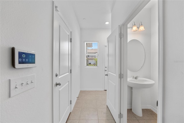 bathroom featuring sink and tile patterned flooring