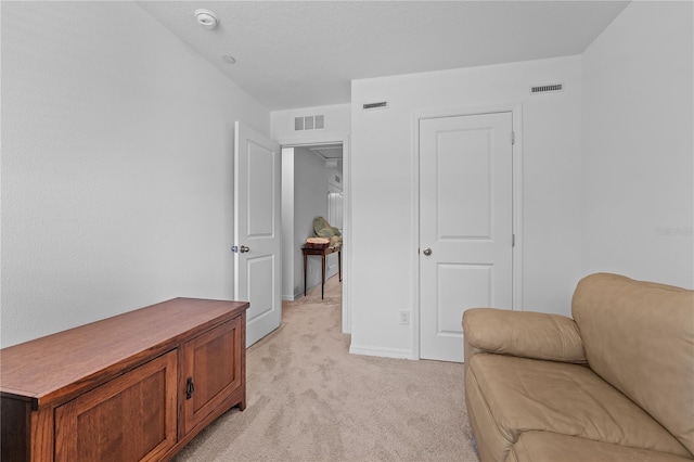 living area with light colored carpet