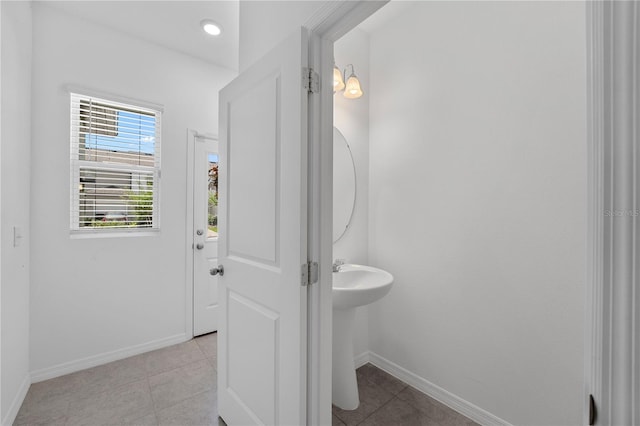 bathroom with tile patterned flooring