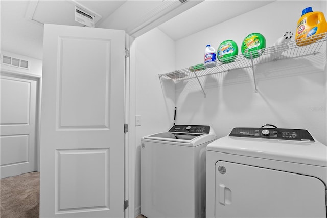 laundry room with independent washer and dryer and carpet floors