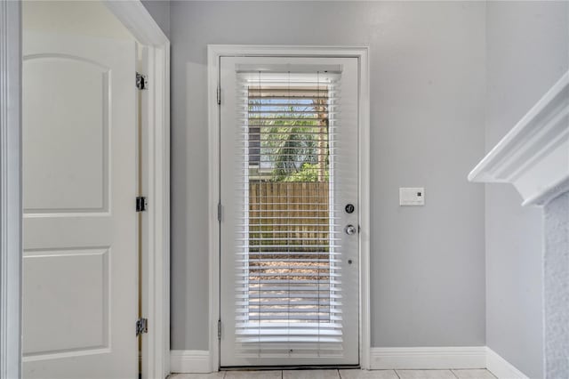 entryway with light tile patterned floors