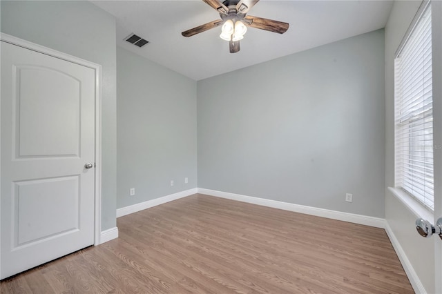 unfurnished room featuring light hardwood / wood-style floors and ceiling fan