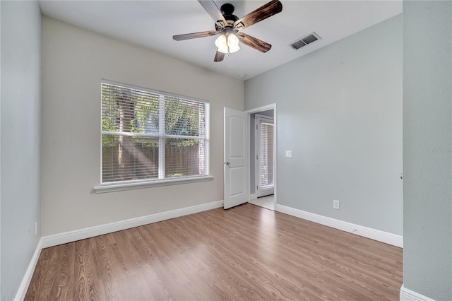 unfurnished room featuring ceiling fan and light wood-type flooring