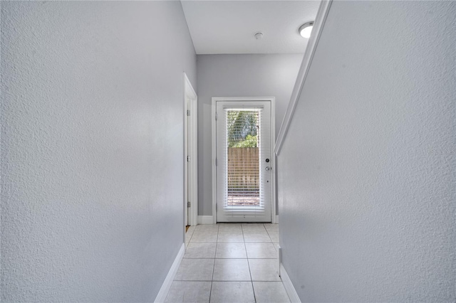 doorway featuring light tile patterned floors