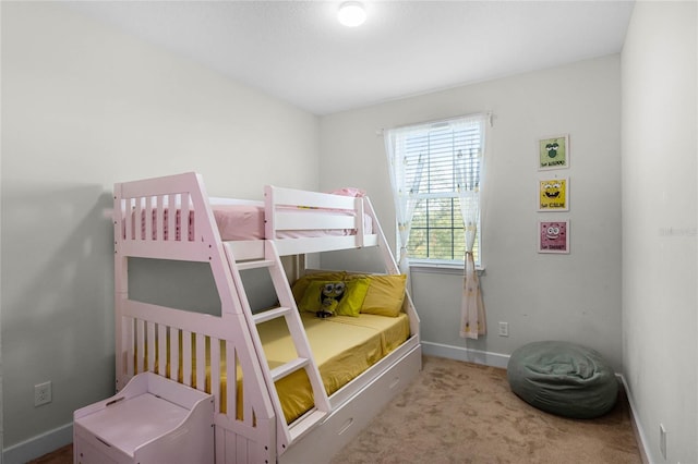 carpeted bedroom with baseboards