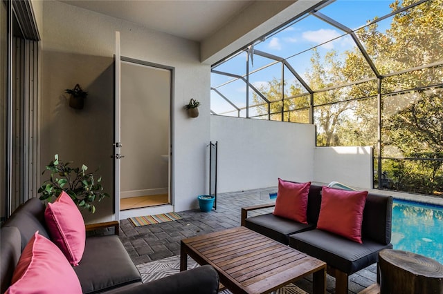 view of patio with a lanai, an outdoor pool, and an outdoor hangout area