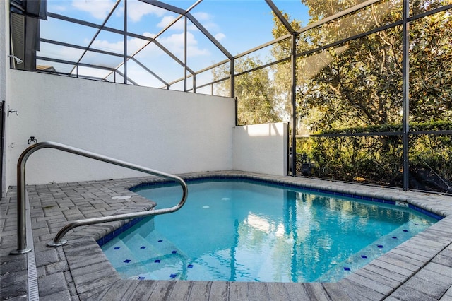 outdoor pool featuring a lanai and a patio