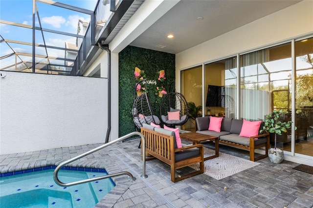 view of patio featuring a swimming pool, glass enclosure, and an outdoor hangout area