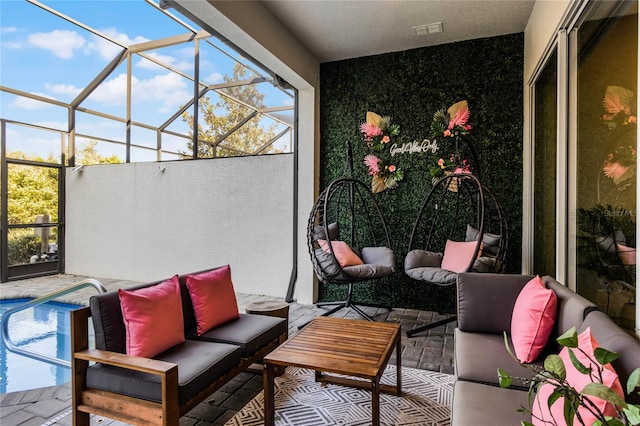 exterior space with visible vents, glass enclosure, an outdoor pool, and outdoor lounge area