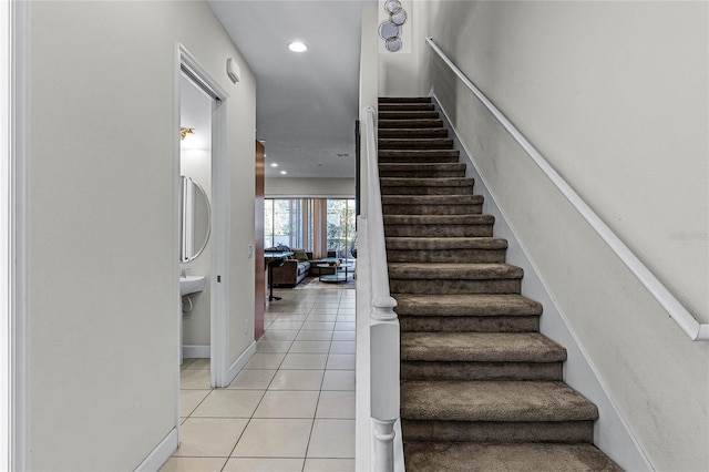 434 Captiva Dr, Davenport, FL 33896 - stairway featuring tile patterned flooring and baseboards