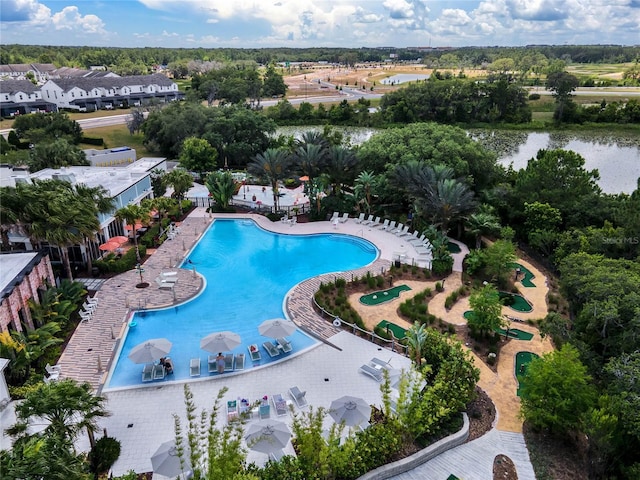 view of swimming pool featuring a water view