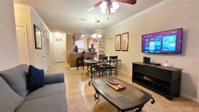 tiled living room with crown molding and ceiling fan