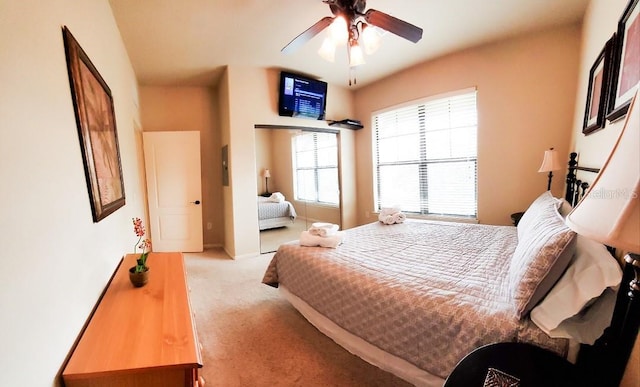 carpeted bedroom featuring ceiling fan