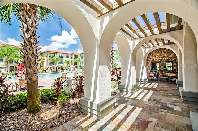 view of patio / terrace featuring a community pool