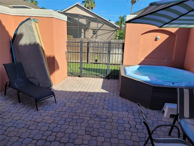 view of patio / terrace featuring a hot tub