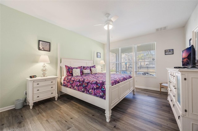 bedroom featuring ceiling fan and dark hardwood / wood-style floors