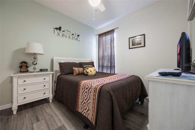 bedroom featuring lofted ceiling, wood-type flooring, and ceiling fan